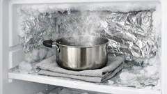 Defrost your freezer fast with the aluminum foil and hot water trick